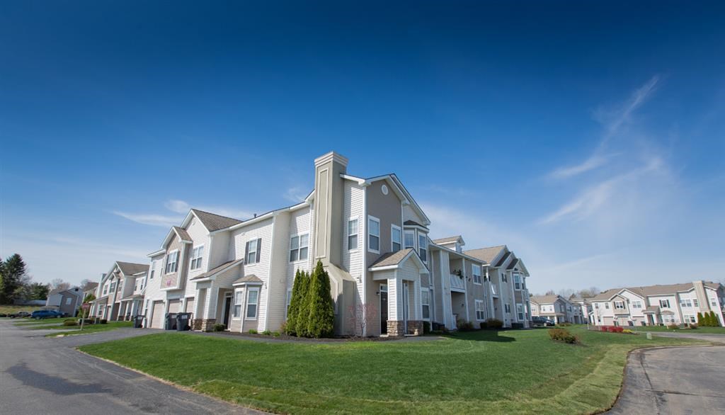 a row of houses on the side of a street
