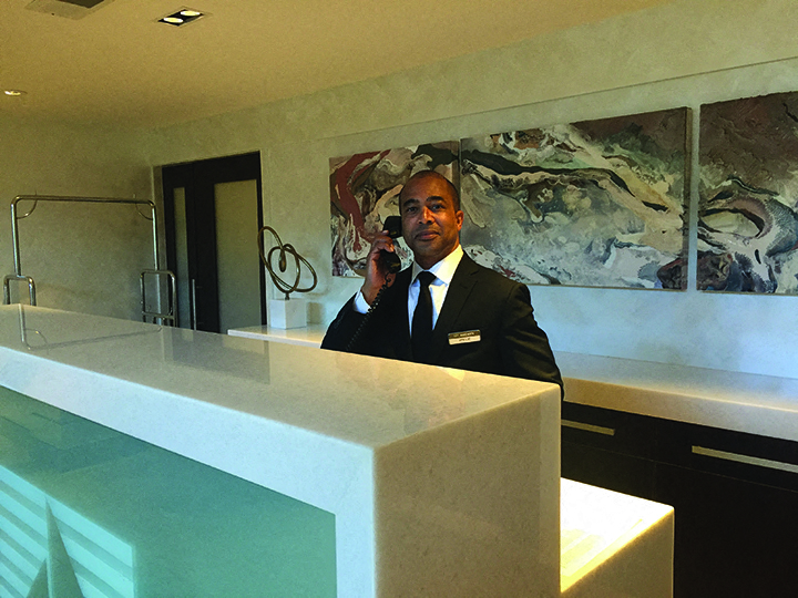 a man in a suit and tie talking on a cell phone