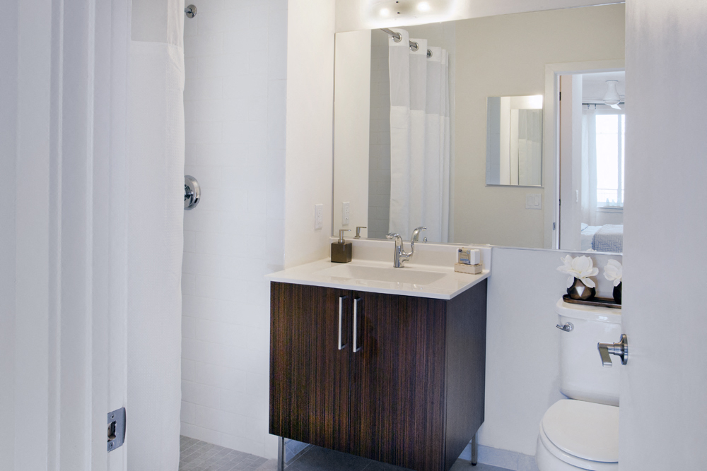 a bathroom with a sink and a mirror and a toilet