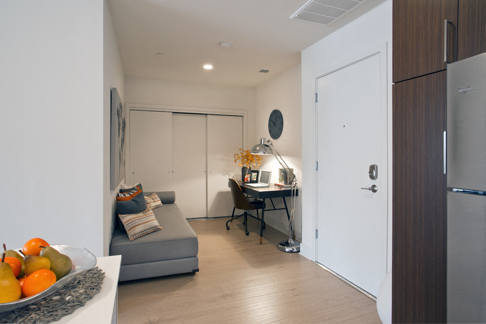 a kitchen and living room in a small apartment
