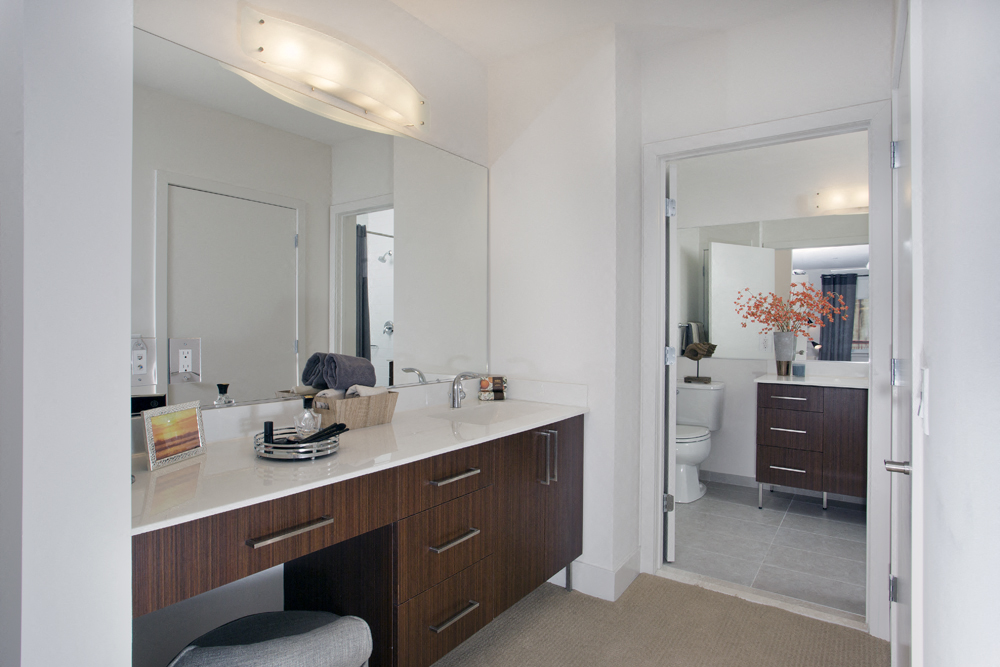 a bathroom with a sink and a mirror and a toilet