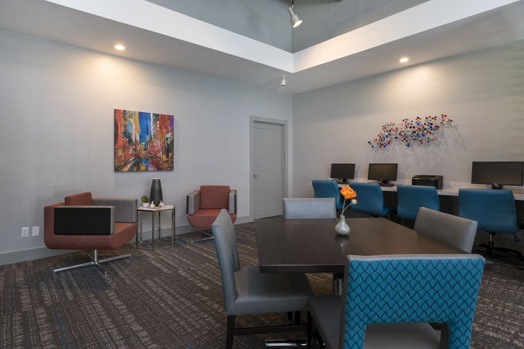 a conference room with a table and chairs