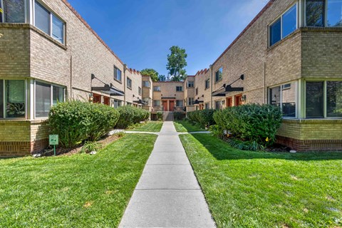 our apartments are located in a quiet neighborhood with a spacious yard and green grass