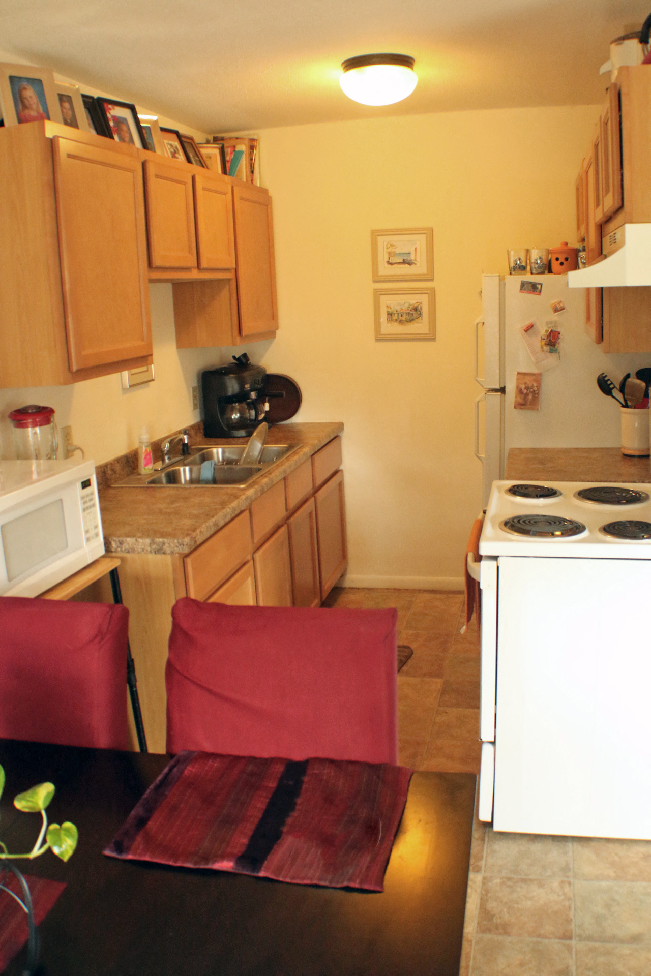 a small kitchen with a table and chairs
