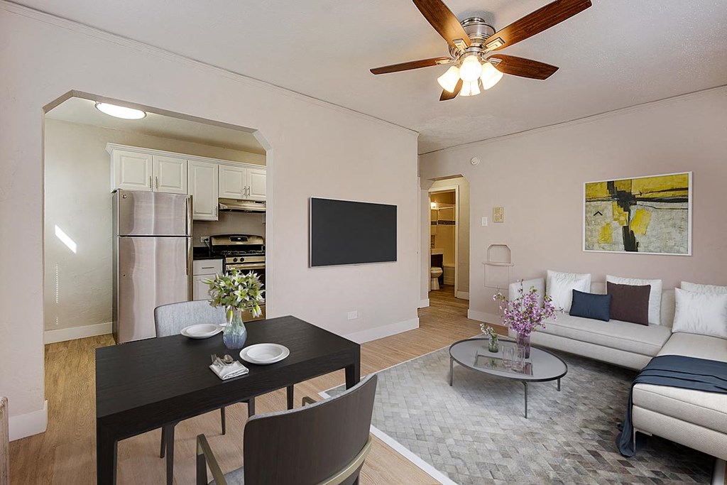 a living room and dining room with a couch and a table