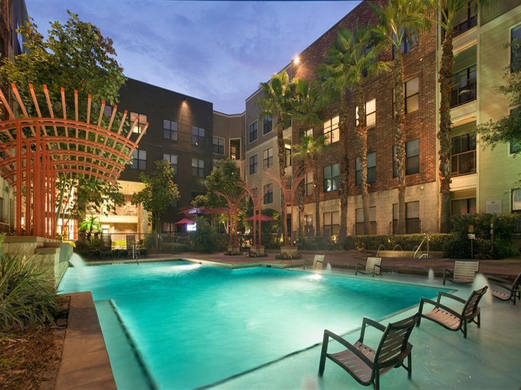 night time exterior of office and pool at The Core, Houston
