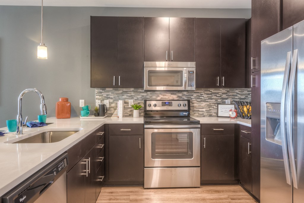 kitchen with stainless steel appliances  at EdgeWater at City Center, Lenexa, KS, 66219