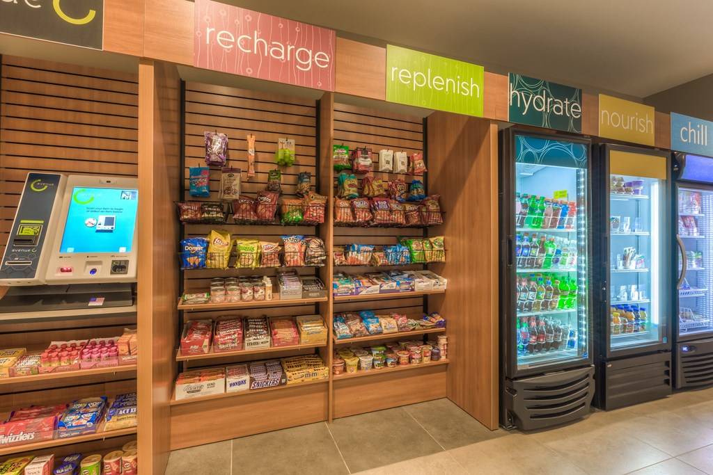 a refrigerated section of the store with a vending machine next to it  at EdgeWater at City Center, Kansas, 66219