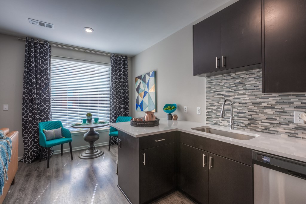 kitchen cabinets with dining table and chairs  at EdgeWater at City Center, Lenexa, 66219