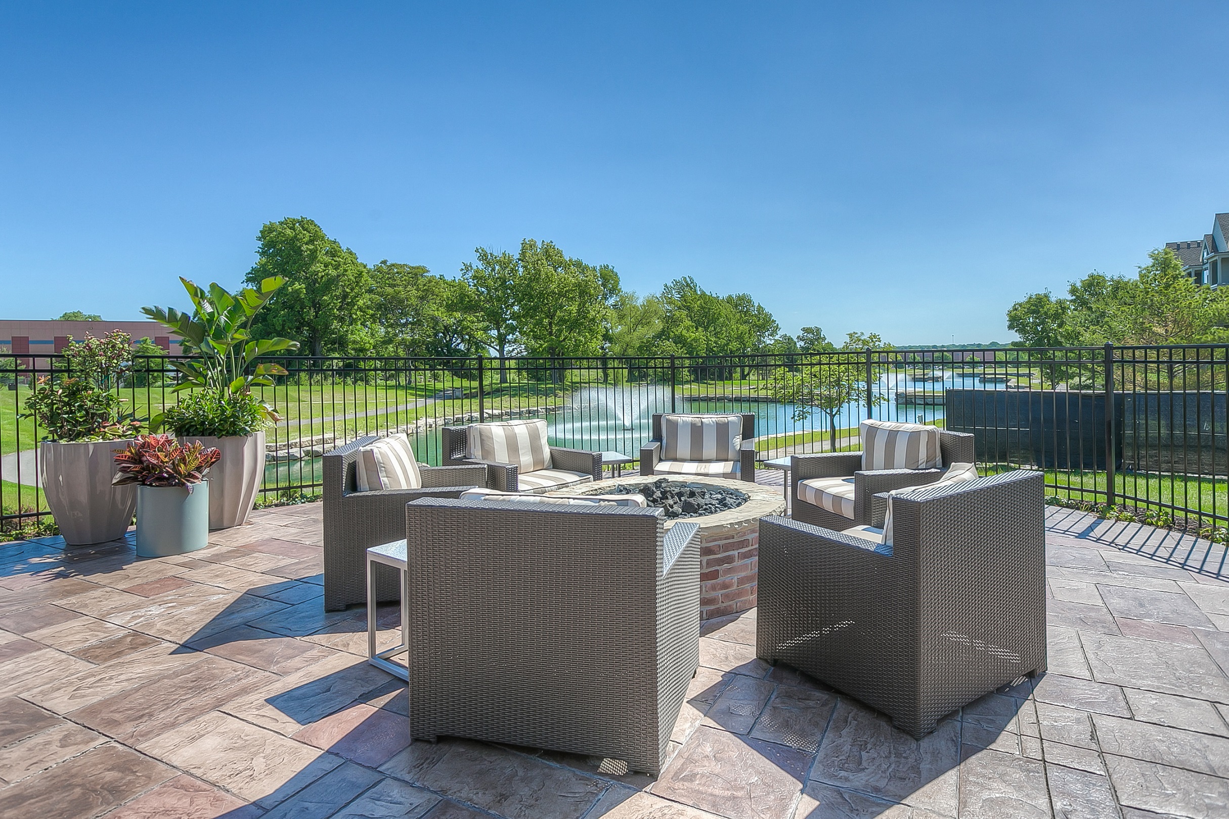 community fire pit with seating  at Waterside Residences on Quivira, Kansas