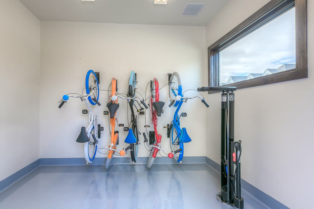a bike rack hanging on the wall in the community bike room  at Waterside Residences on Quivira, Lenexa, KS, 66215