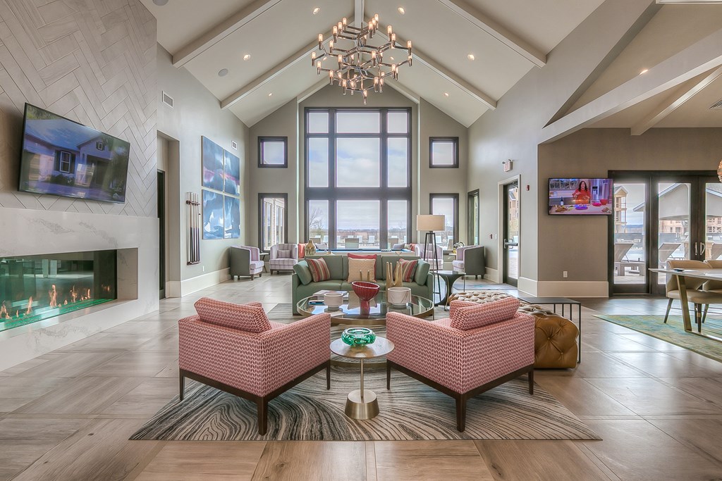 clubhouse entrance with seating in front of a fireplace  at Waterside Residences on Quivira, Kansas