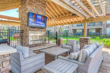 Outdoor Fireplace with Seating and TV