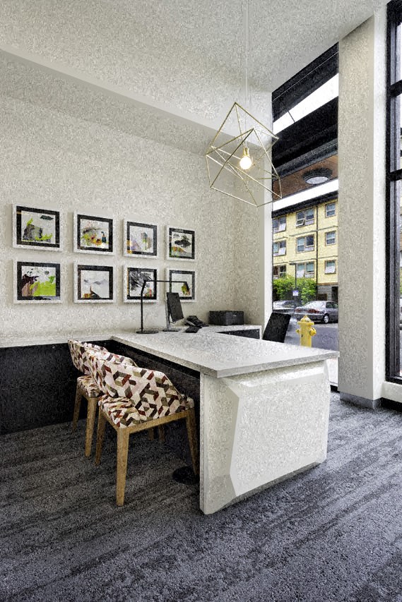 an office with a white desk and a table with chairs