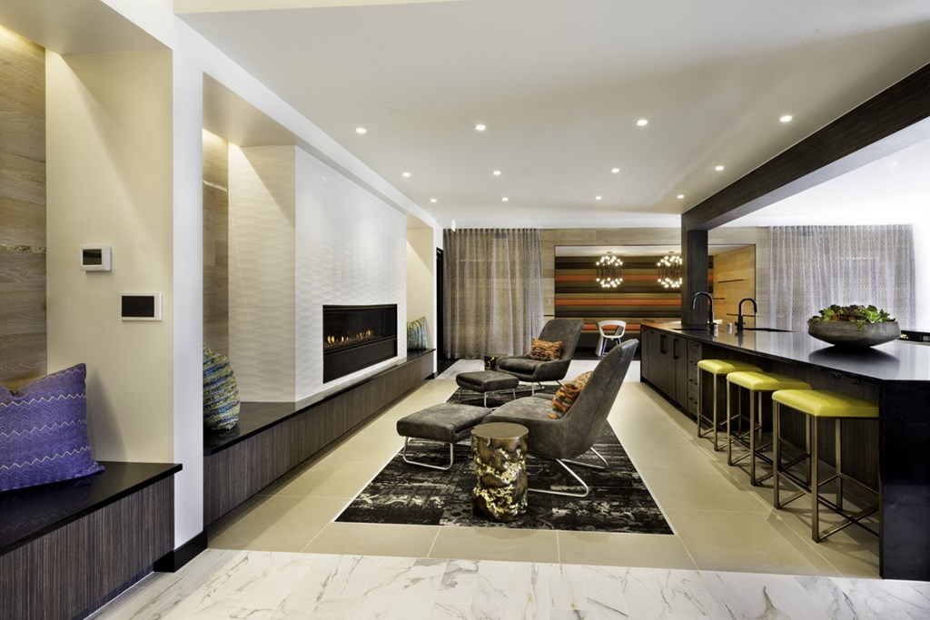 a living room with a couch and a table and a fireplace