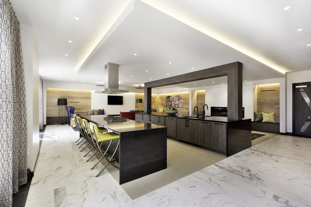 a kitchen and dining area with a long table and chairs