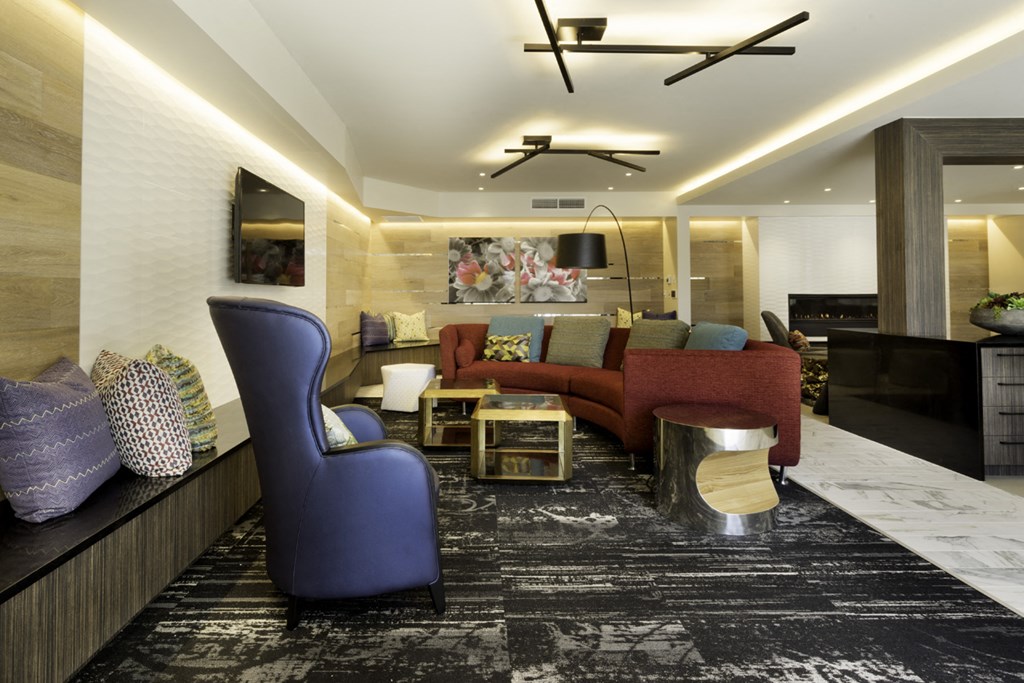 a living room filled with furniture and a rug