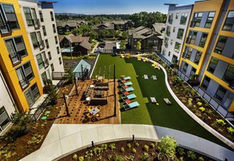 an aerial view of the courtyard of an apartment complex