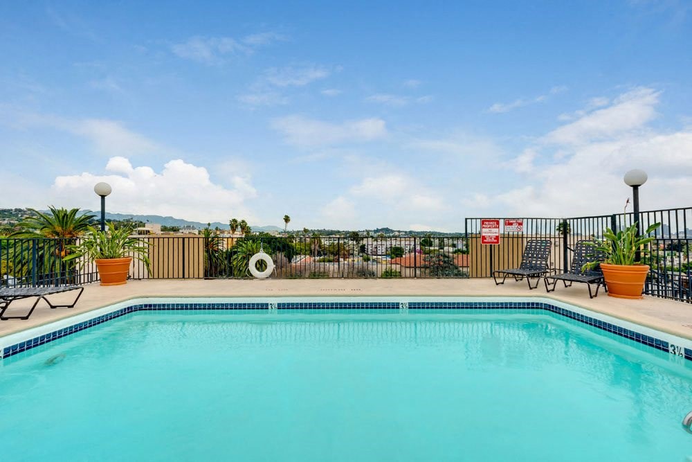 the swimming pool at the resort on a sunny day