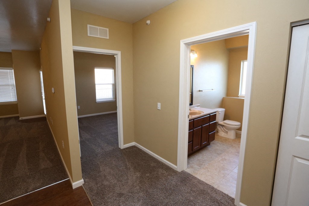a bathroom with a sink and a toilet in a house