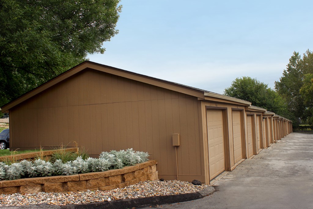 a row of garages in front of a building