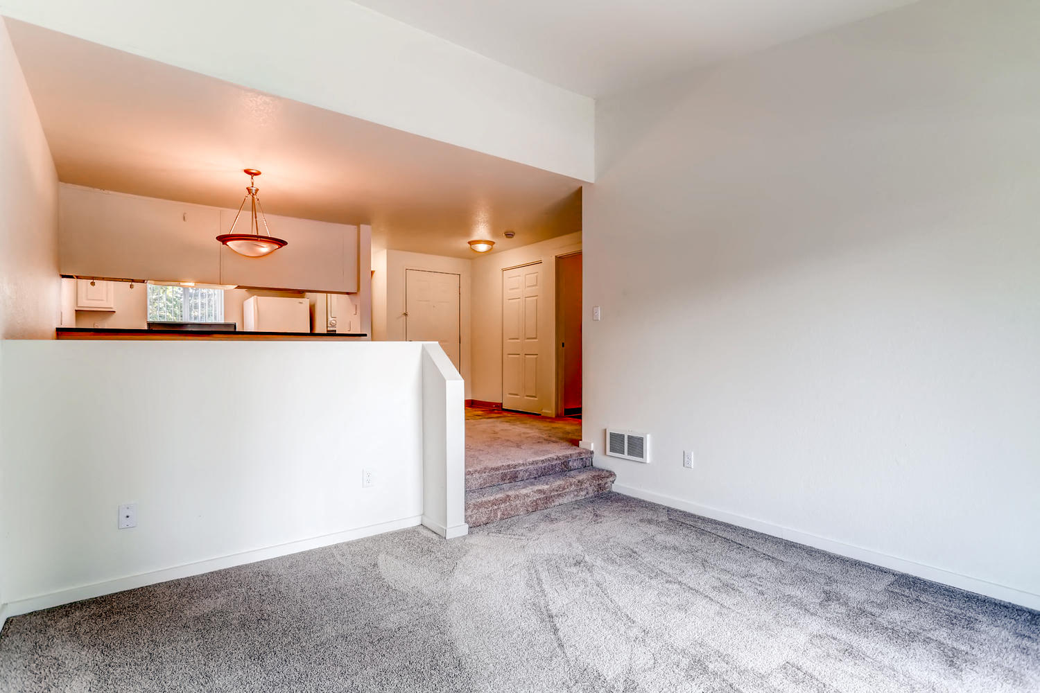 A Standard Living Room and Kitchen at The Courtyard at South Station