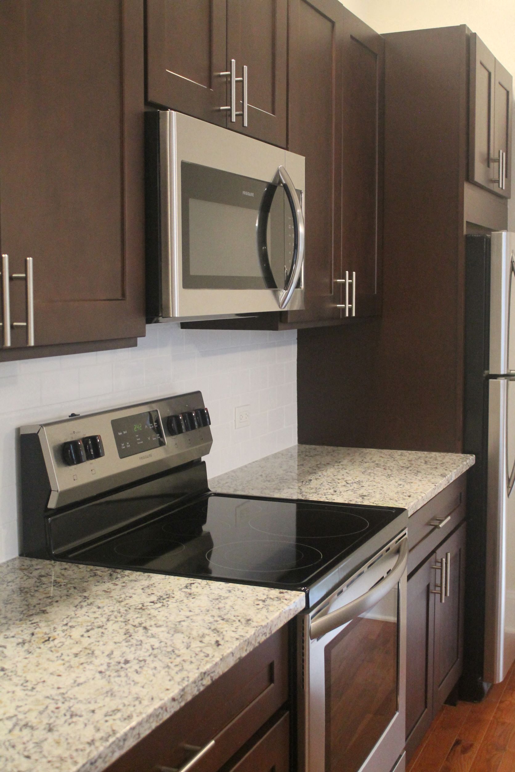 a kitchen with a stove and a microwave