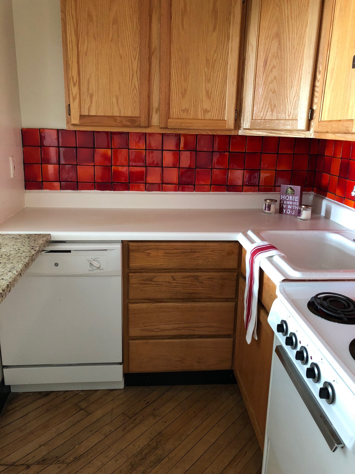 a kitchen with white appliances and wooden cabinets