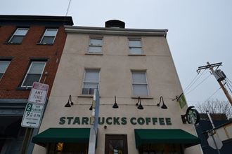 a building with a starbucks coffee sign in front of it