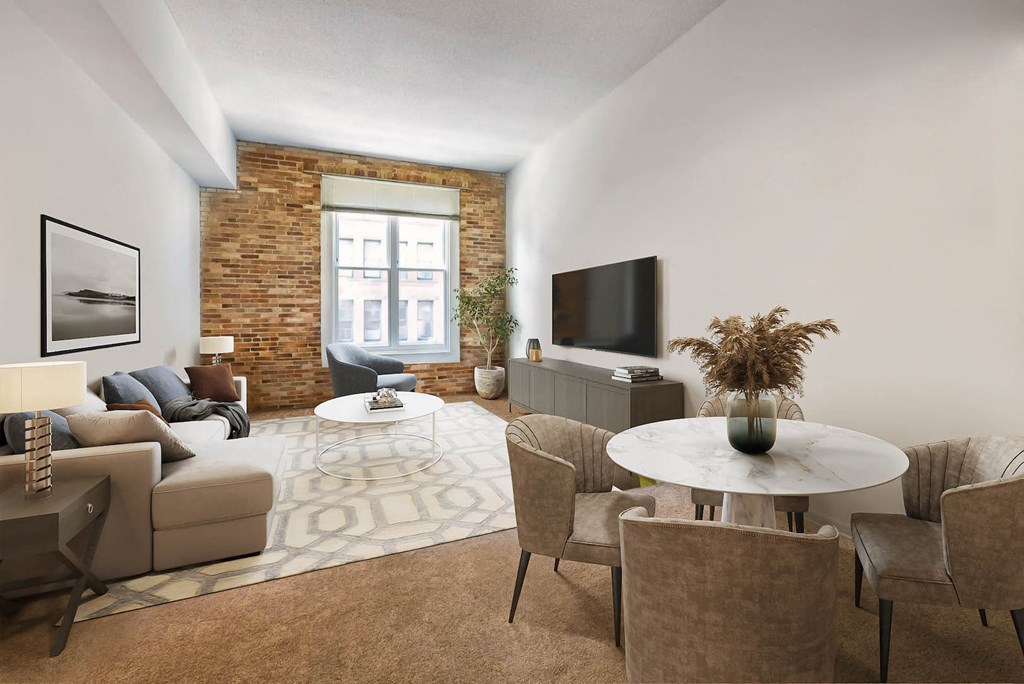 a living room with a couch and a table and a television