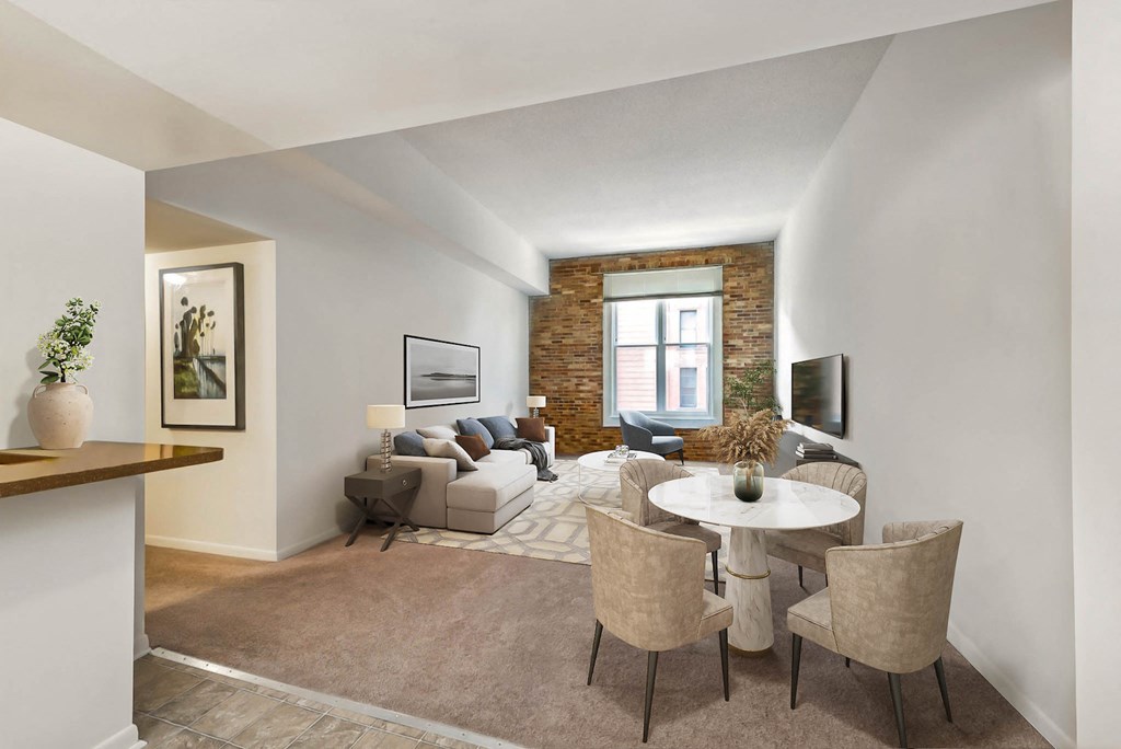 a living room with a couch and a table and a tv