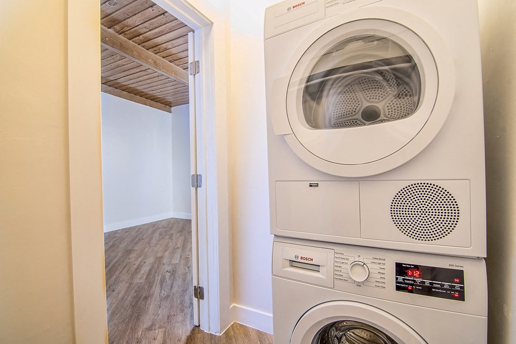 a laundry room with a washing machine and a dryer