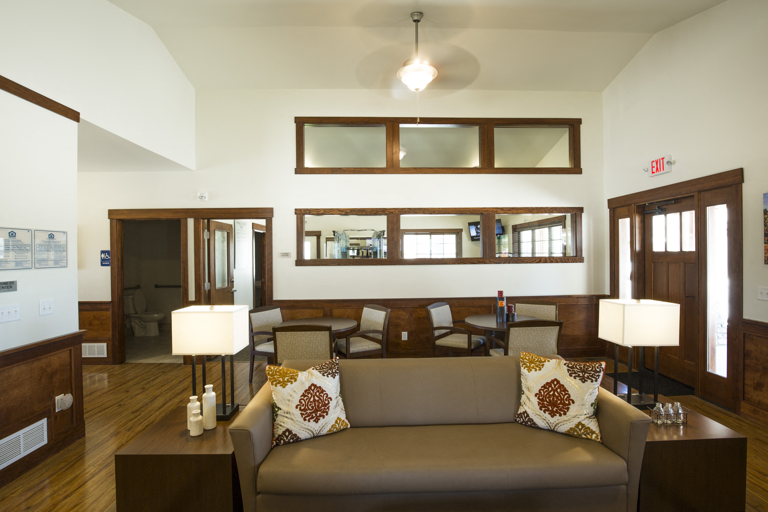 Image of doors, entry to bathroom, and mirrors on wall