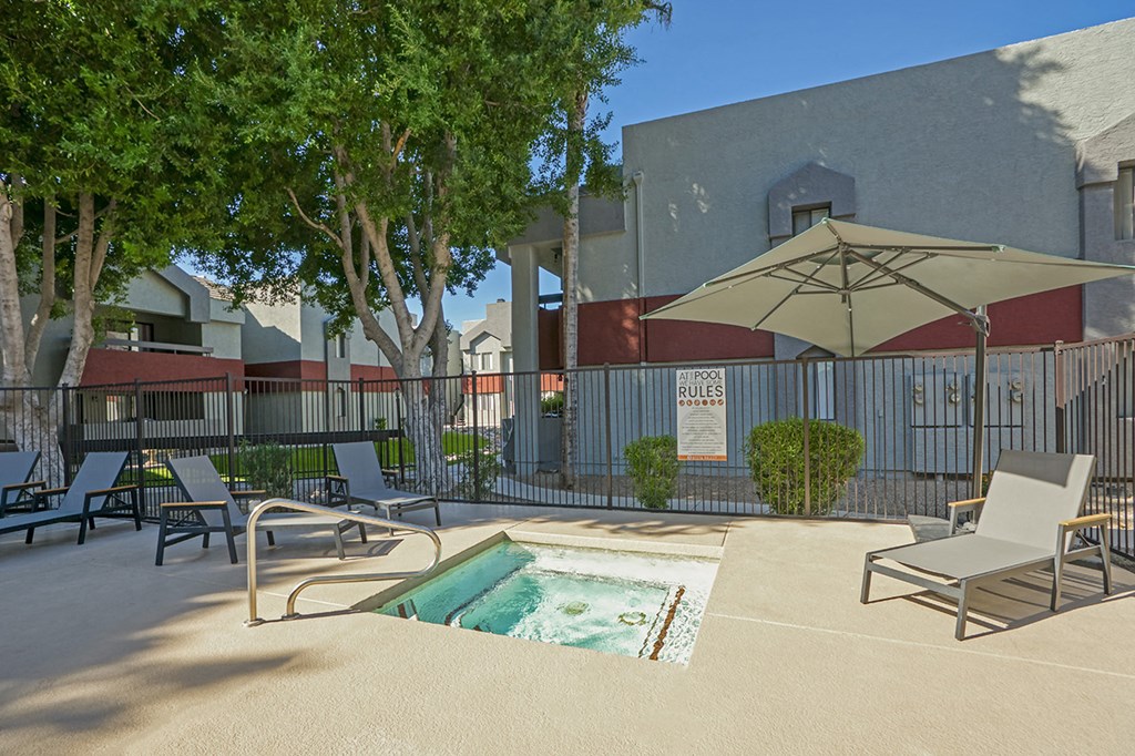 our apartments have a resort style pool and lounge chairs