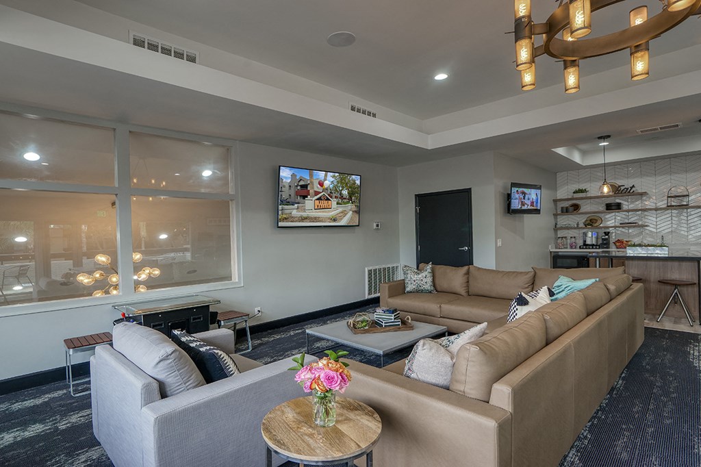 a living room with couches and a coffee table