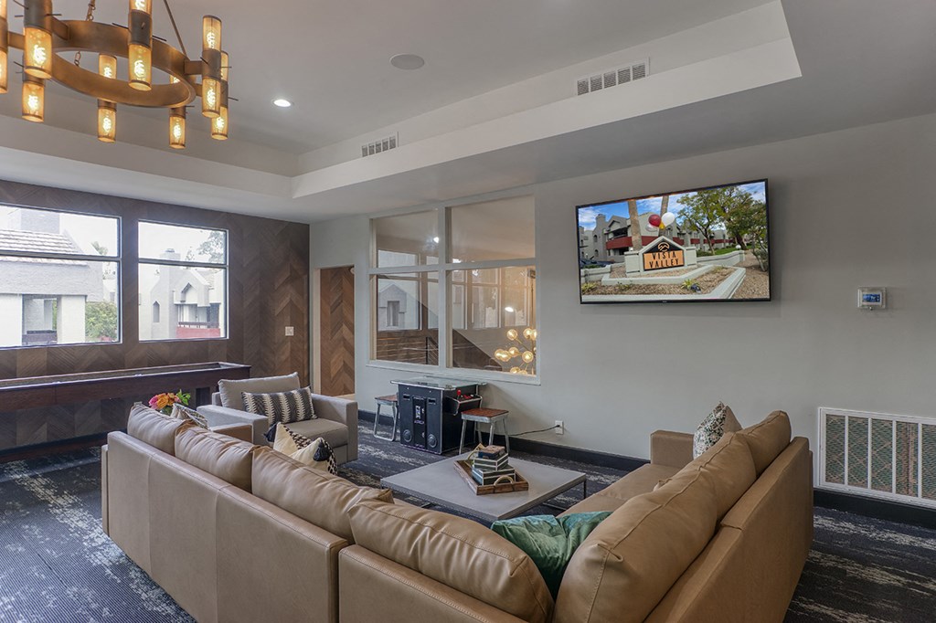 a living room with a couch and a table and a tv