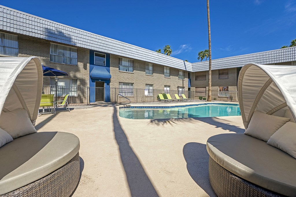 our apartments have a pool and lounge chairs in the courtyard