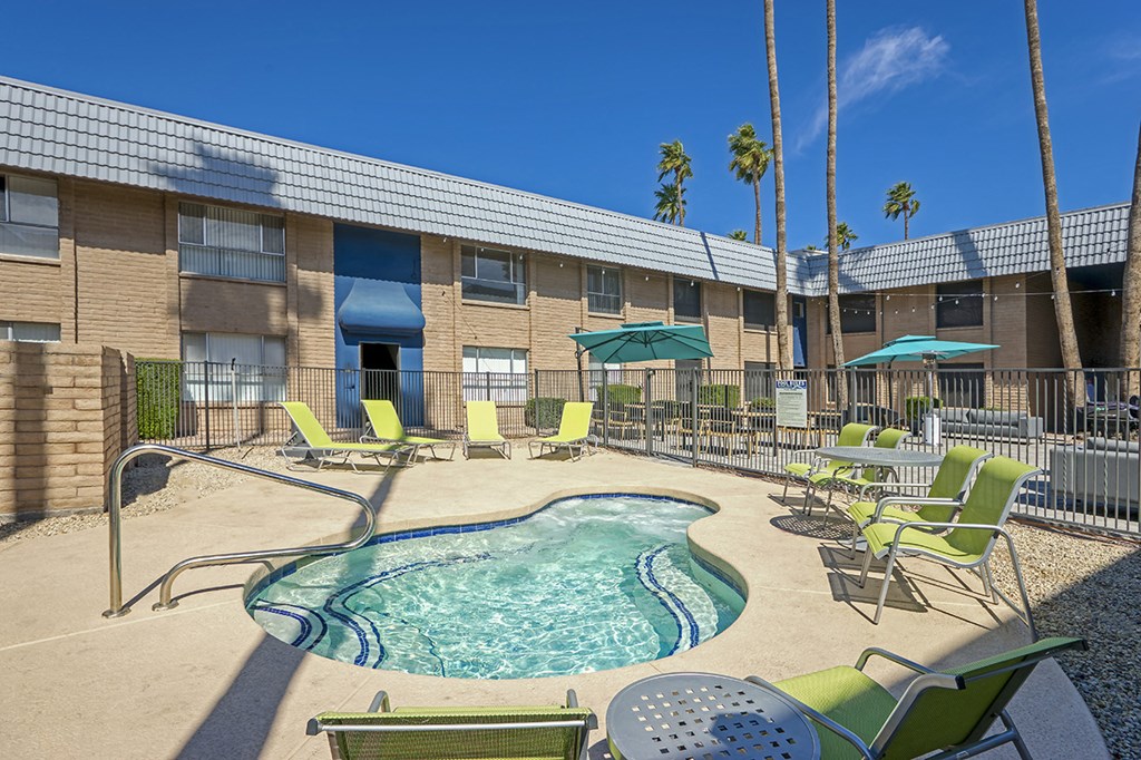 our apartments have a resort style pool and lounge chairs