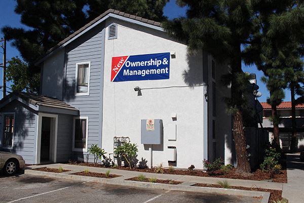 a white building with a sign on the side of it