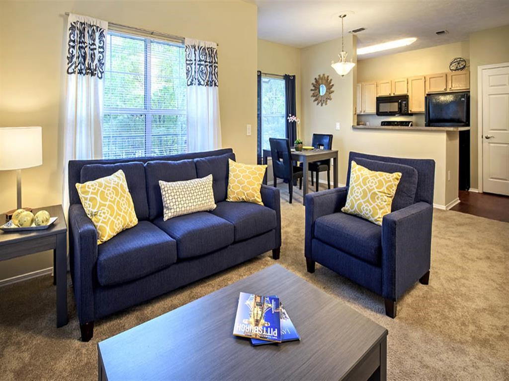 a living room with a couch and a table