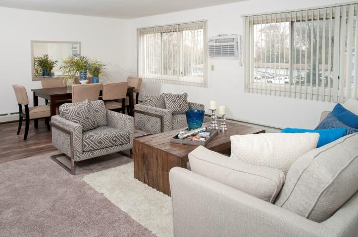 Large Natural Light Windows in Open Living and Dining Room Floor Plan at 8920 Wentworth Apartments