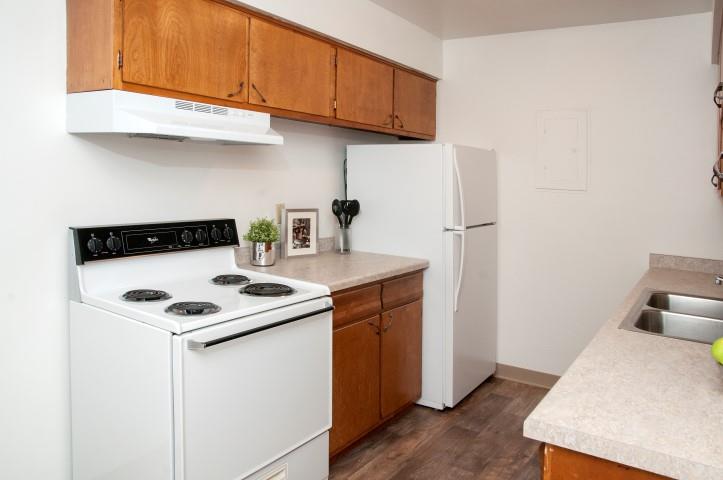 Kitchen in Bloomington Apartment with Gas Stove and Light Counter Tops