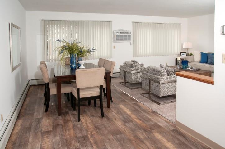 Dark Hard Wood Flooring in Dining Room of 8920 Wentworth Apartments in Minneapolis, MN