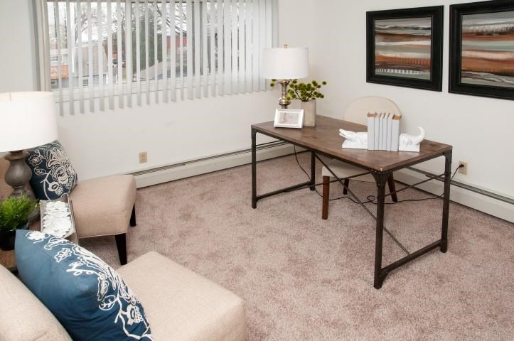 a living room with a table and a couch