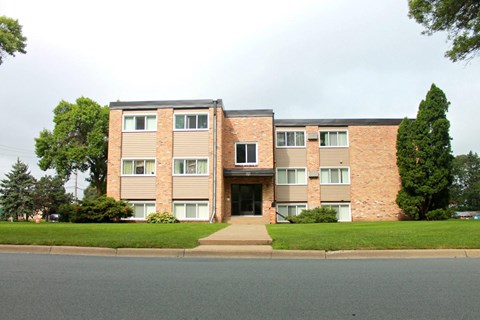 an apartment building on the corner of a street