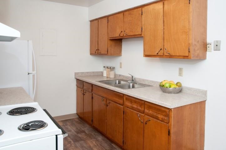 a kitchen with a stove and a sink