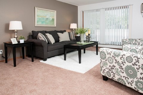 a living room with a couch and a chair
