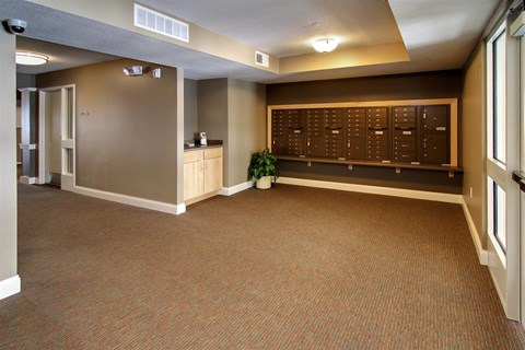 a large room with a locker room and a plant