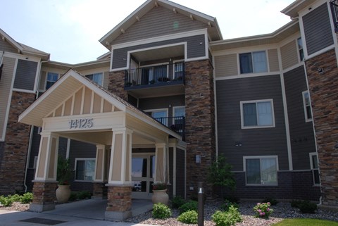 a view of the front of a building with a porch