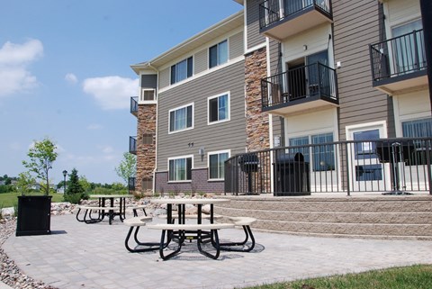 our apartments have an outdoor patio with tables